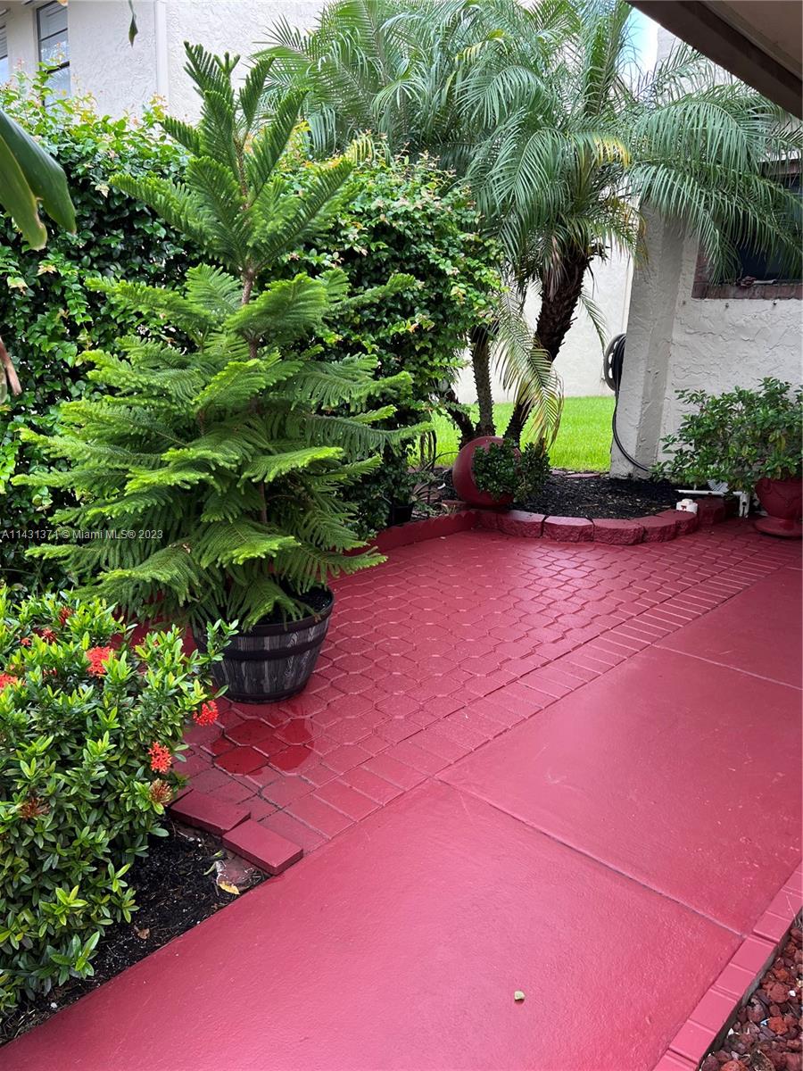 23314 Southwest 54th Way, Unit E Boca Raton, FL 33433 - Photo 16 of 69 a view of a backyard of a house