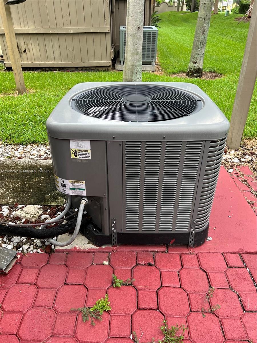 23314 Southwest 54th Way, Unit E Boca Raton, FL 33433 - Photo 22 of 69 a front view of a house with a yard