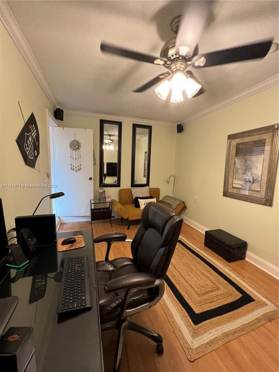 23314 Southwest 54th Way, Unit E Boca Raton, FL 33433 - Photo 27 of 69 a living room with furniture and a window