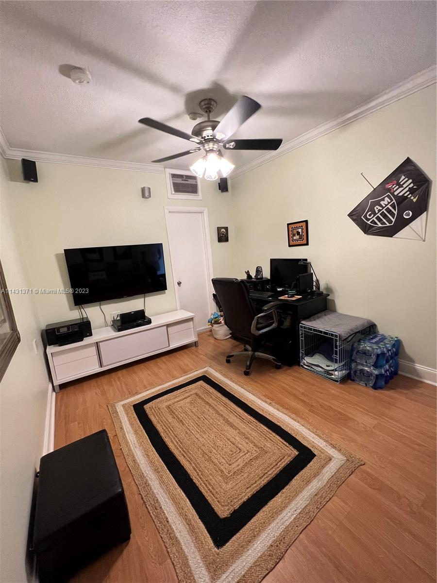 23314 Southwest 54th Way, Unit E Boca Raton, FL 33433 - Photo 28 of 69 a living room with furniture and a flat screen tv