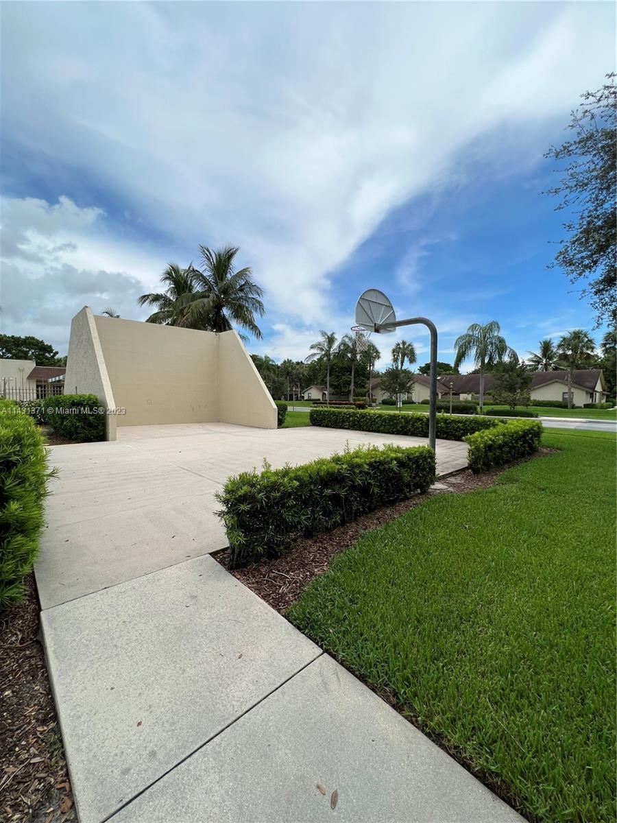 23314 Southwest 54th Way, Unit E Boca Raton, FL 33433 - Photo 3 of 69 a view of a street with a building in the background