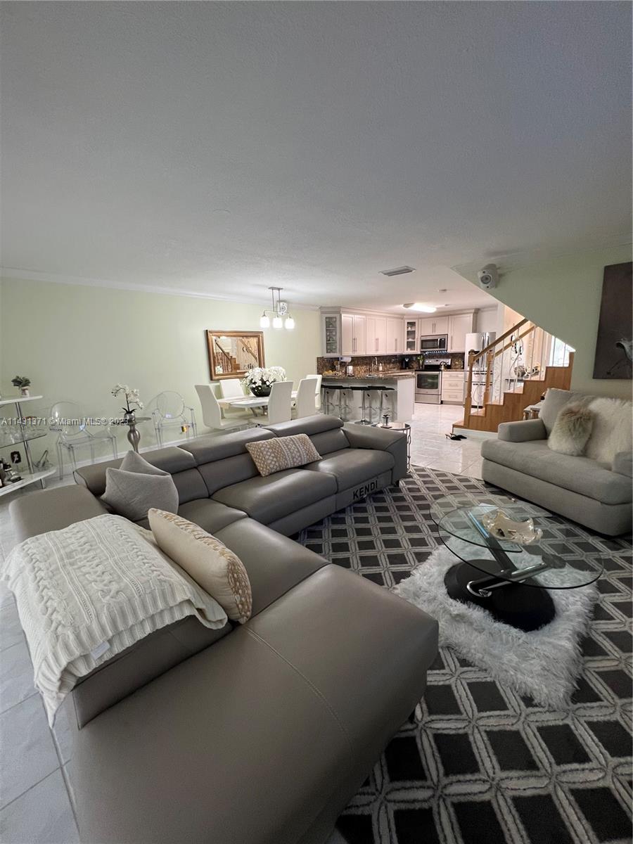 23314 Southwest 54th Way, Unit E Boca Raton, FL 33433 - Photo 45 of 69 a living room with furniture and a rug