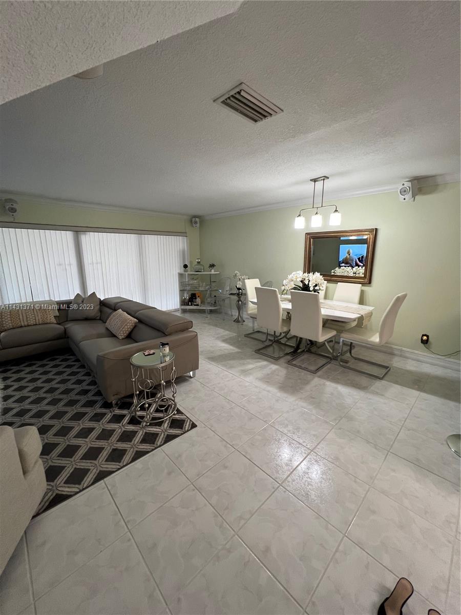 23314 Southwest 54th Way, Unit E Boca Raton, FL 33433 - Photo 46 of 69 a living room with furniture