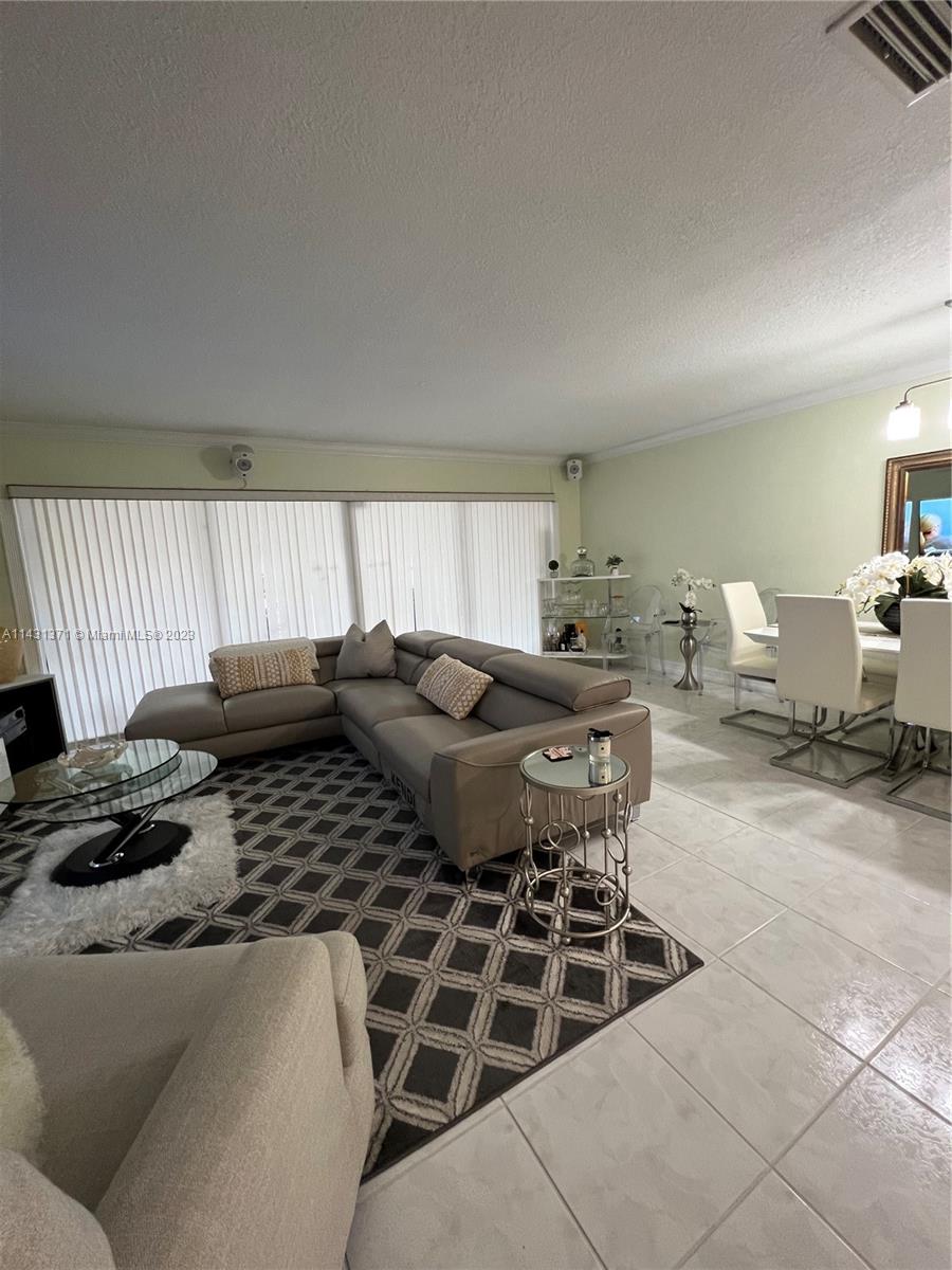 23314 Southwest 54th Way, Unit E Boca Raton, FL 33433 - Photo 47 of 69 a living room with furniture