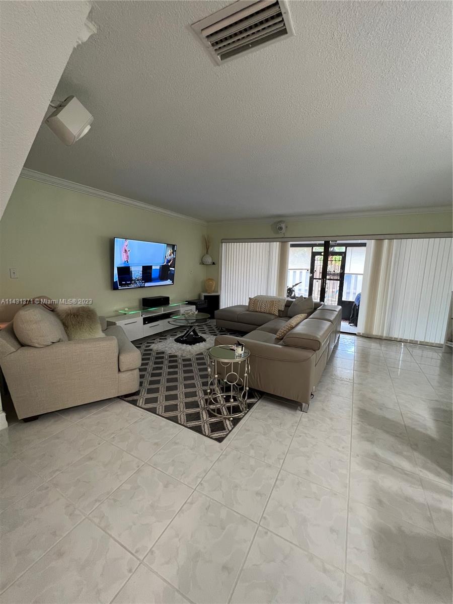 23314 Southwest 54th Way, Unit E Boca Raton, FL 33433 - Photo 48 of 69 a living room with furniture