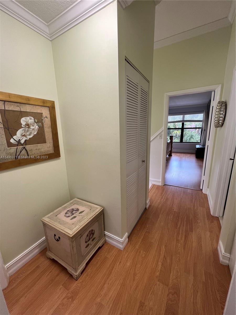 23314 Southwest 54th Way, Unit E Boca Raton, FL 33433 - Photo 53 of 69 a view of a hallway to a livingroom with furniture