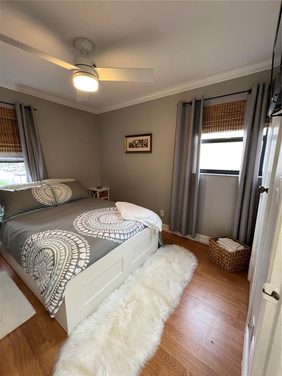 23314 Southwest 54th Way, Unit E Boca Raton, FL 33433 - Photo 54 of 69 a bedroom with a bed and a large mirror