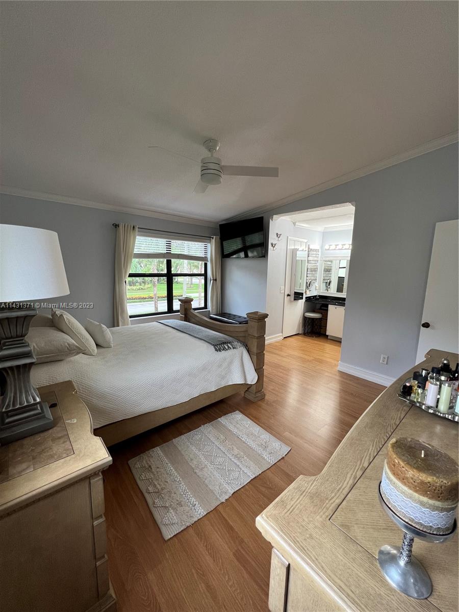 23314 Southwest 54th Way, Unit E Boca Raton, FL 33433 - Photo 67 of 69 a bed room with two beds and a couch