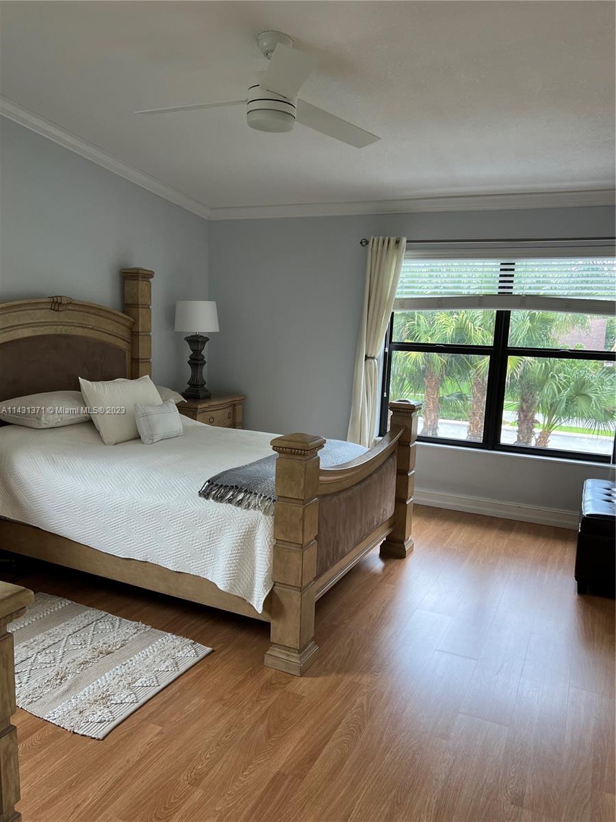 23314 Southwest 54th Way, Unit E Boca Raton, FL 33433 - Photo 69 of 69 a bedroom with a bed and window