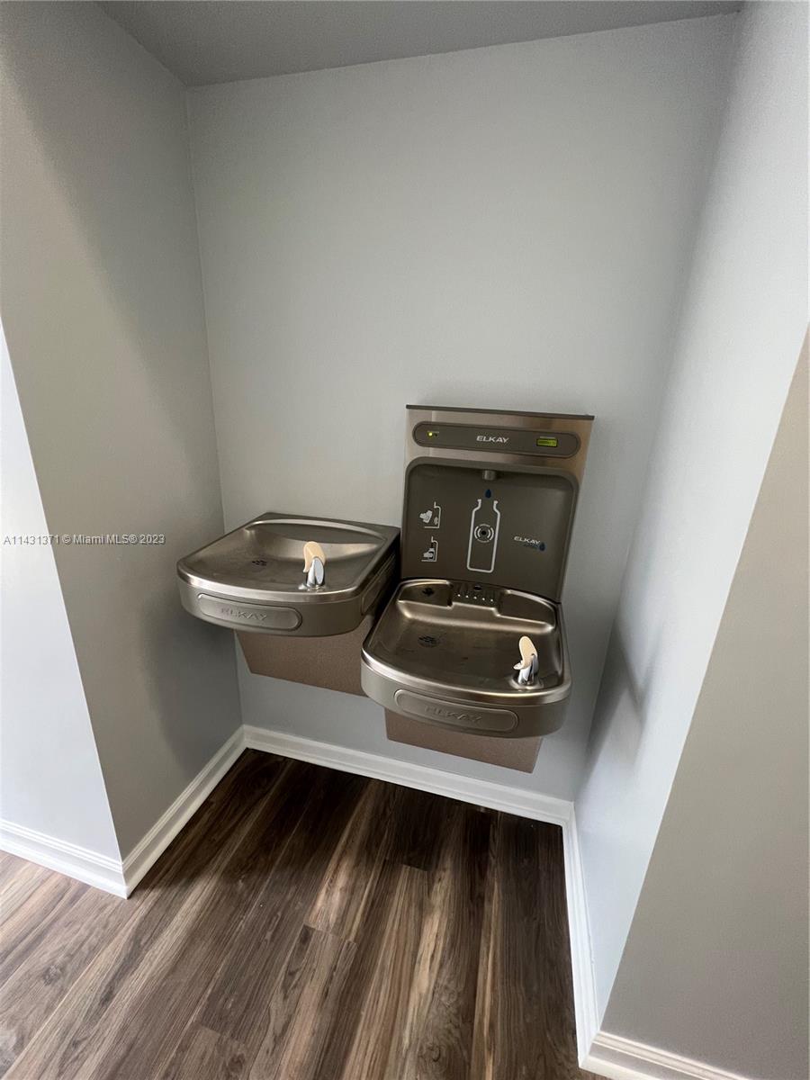 23314 Southwest 54th Way, Unit E Boca Raton, FL 33433 - Photo 9 of 69 a bathroom with a sink and a mirror