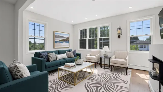 a living room with furniture and windows