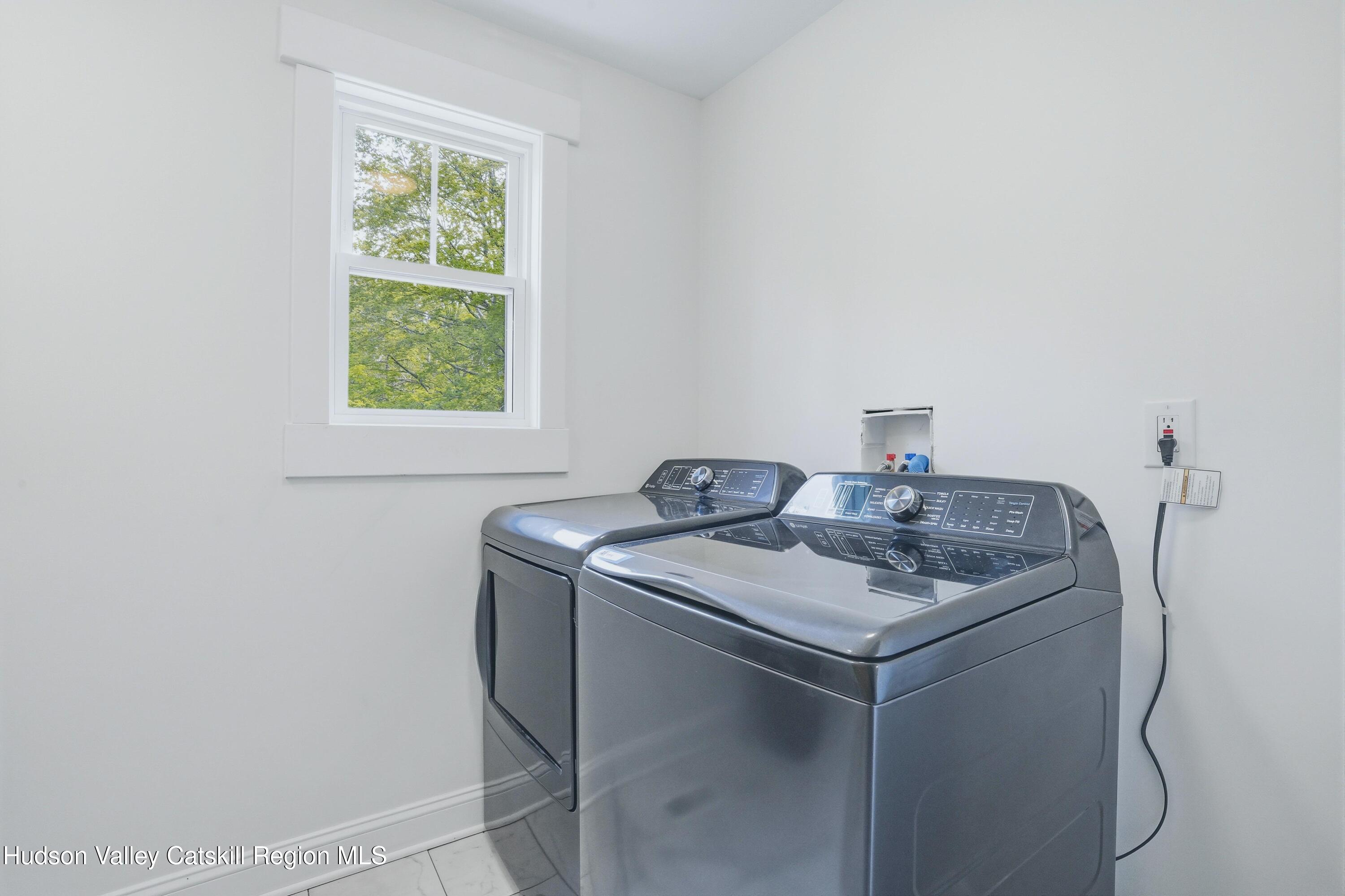 757 Taborton Road Sand Lake, NY 12153 - Photo 17 of 32 a utility room with dryer and washer