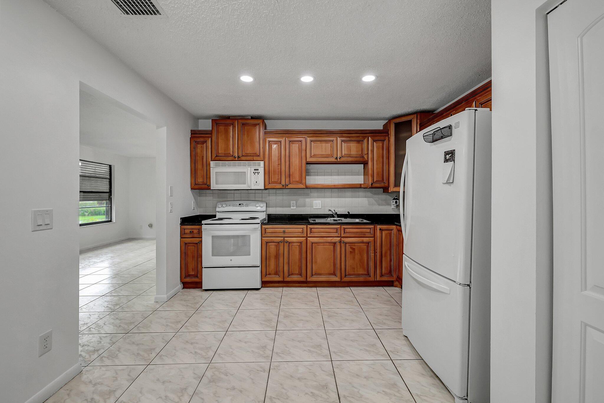 2050 Colonial Road, Unit 6 Fort Pierce, FL 34950 - Photo 7 of 21 kitchen 2