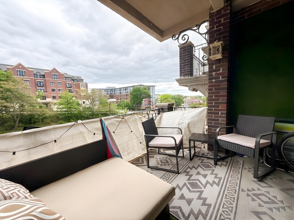 1472 Commonwealth Avenue, Unit 2 Boston, MA 02135 - Photo 1 of 16 a view of balcony with chairs