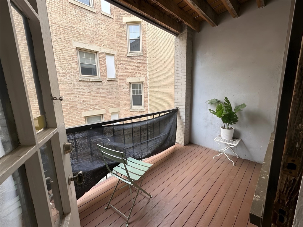 1472 Commonwealth Avenue, Unit 2 Boston, MA 02135 - Photo 11 of 16 a view of balcony with a potted plant