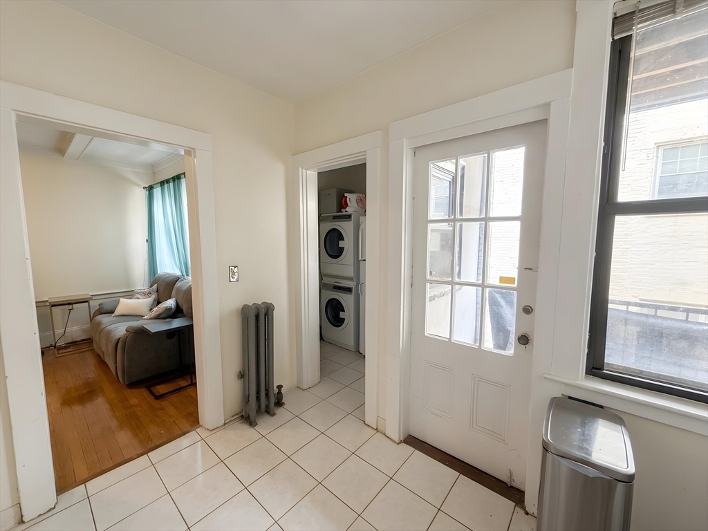 1472 Commonwealth Avenue, Unit 2 Boston, MA 02135 - Photo 12 of 16 a view of a livingroom with furniture and windows