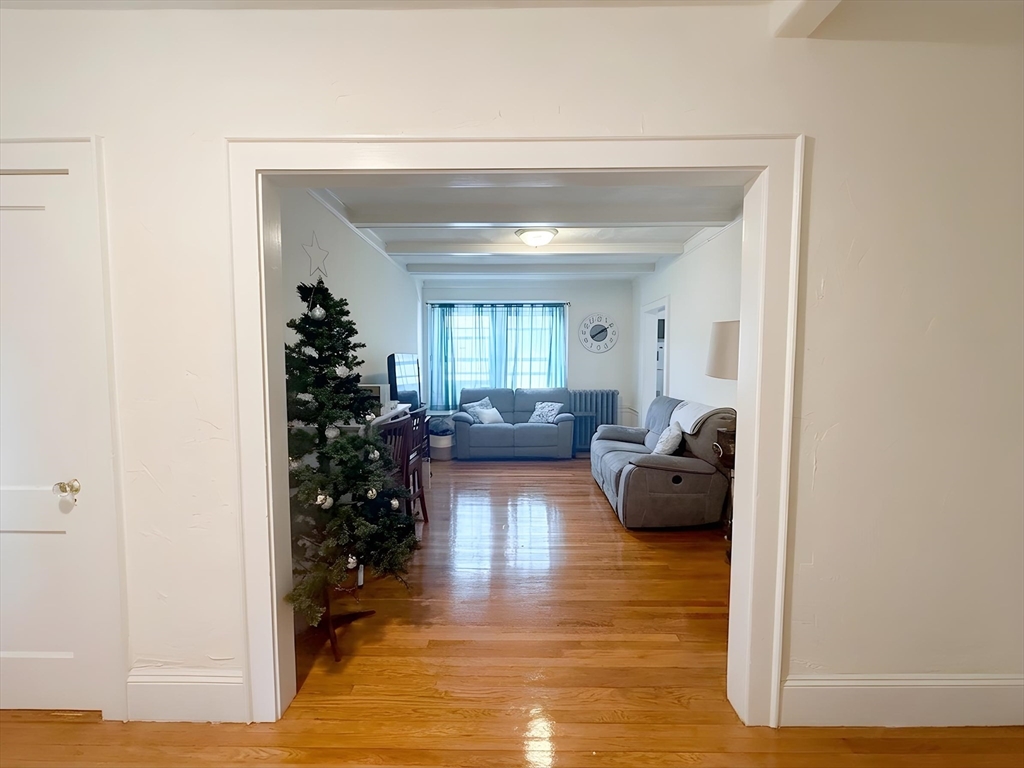 1472 Commonwealth Avenue, Unit 2 Boston, MA 02135 - Photo 13 of 16 a living room with furniture and a large window