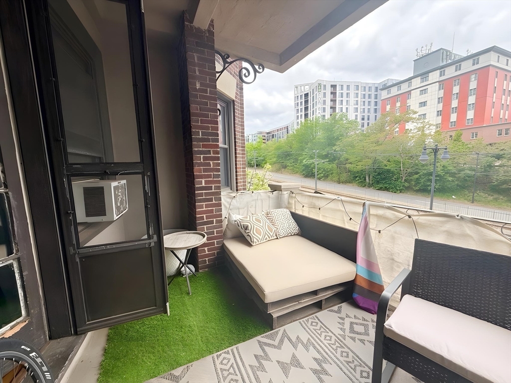 1472 Commonwealth Avenue, Unit 2 Boston, MA 02135 - Photo 7 of 16 a balcony with furniture and a view of balcony