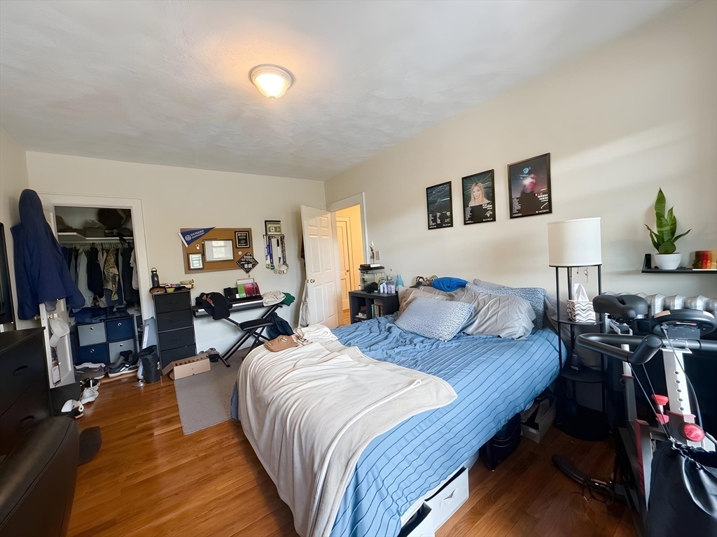 1472 Commonwealth Avenue, Unit 2 Boston, MA 02135 - Photo 8 of 16 a bed room with a bed and a tv