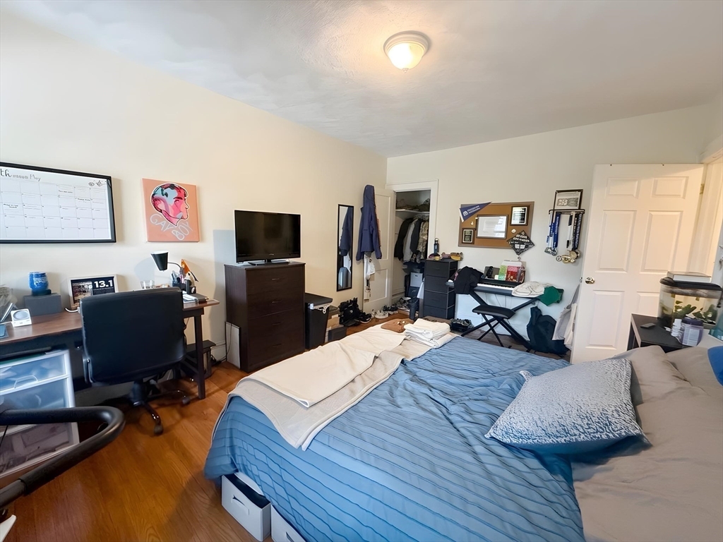 1472 Commonwealth Avenue, Unit 2 Boston, MA 02135 - Photo 9 of 16 a living room with furniture a flat screen tv and a window
