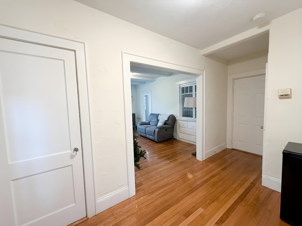 1472 Commonwealth Avenue, Unit 2 Boston, MA 02135 - Photo 10 of 16 a en suite bathroom with a sink and a mirror