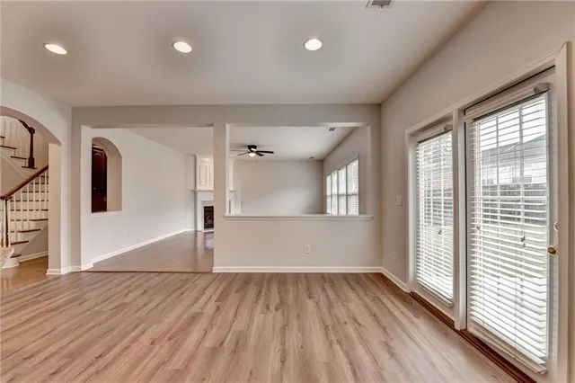 wooden floor in an empty room with a fireplace