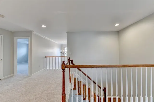an empty room with a ceiling fan and window