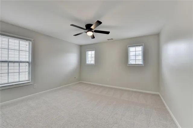 a view of a house with pool and sitting area