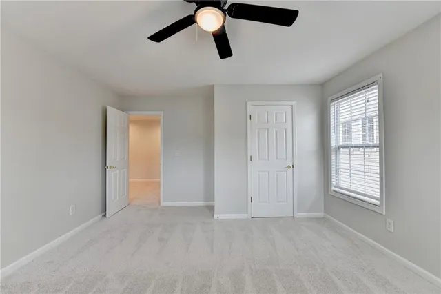 a view of a house with yard and sitting area