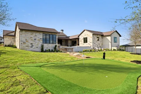 a aerial view of a house with a yard