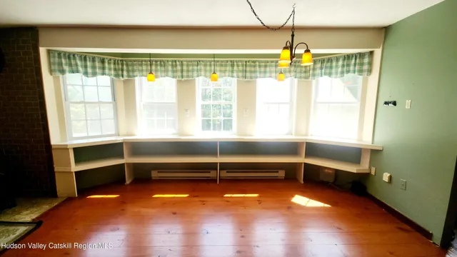 a view of a livingroom with furniture and a flat screen tv