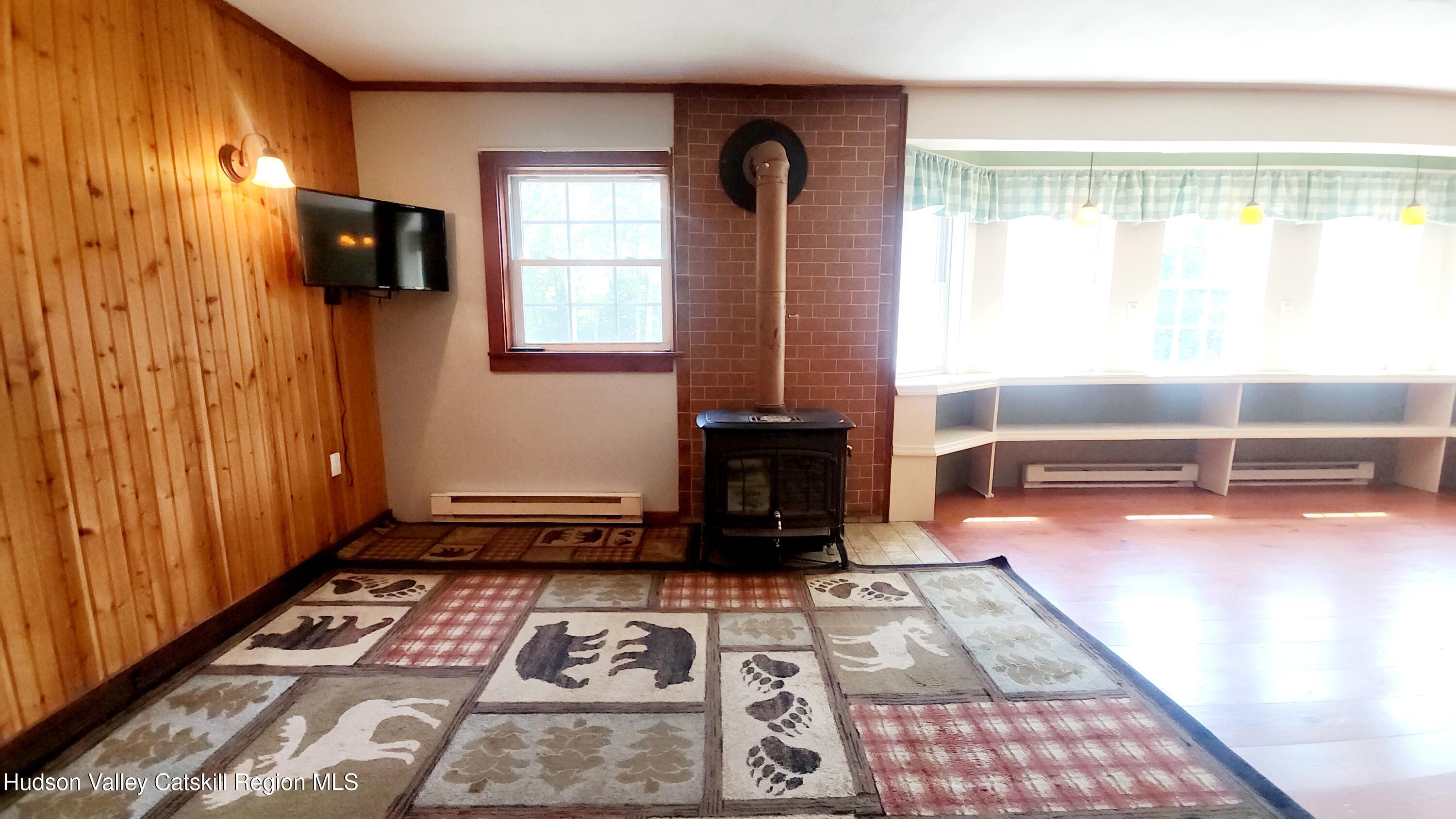 783 Broome Center Road Preston Hollow, NY 12469 - Photo 14 of 34 a room with window and a table