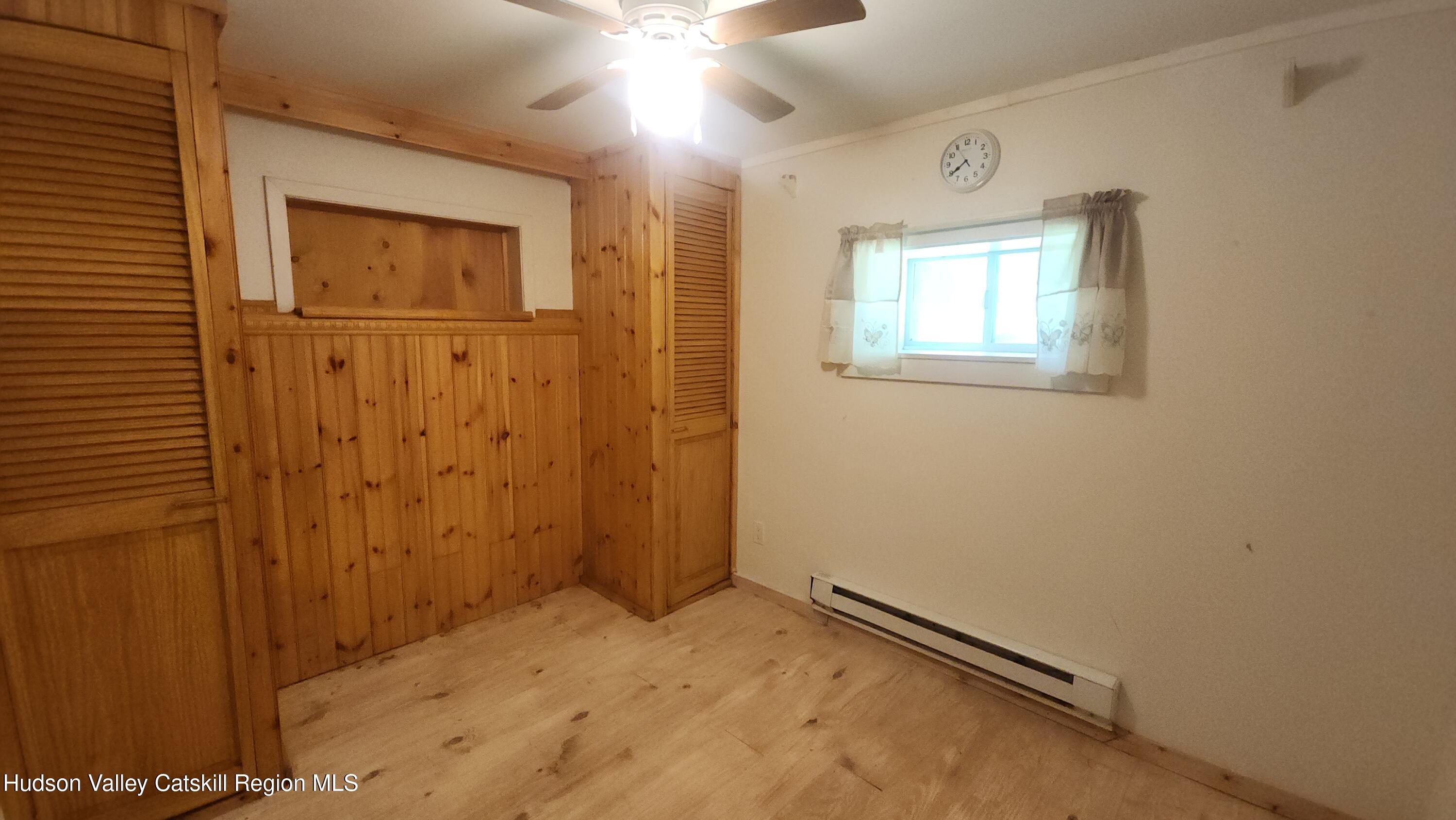 783 Broome Center Road Preston Hollow, NY 12469 - Photo 25 of 34 an empty room with windows