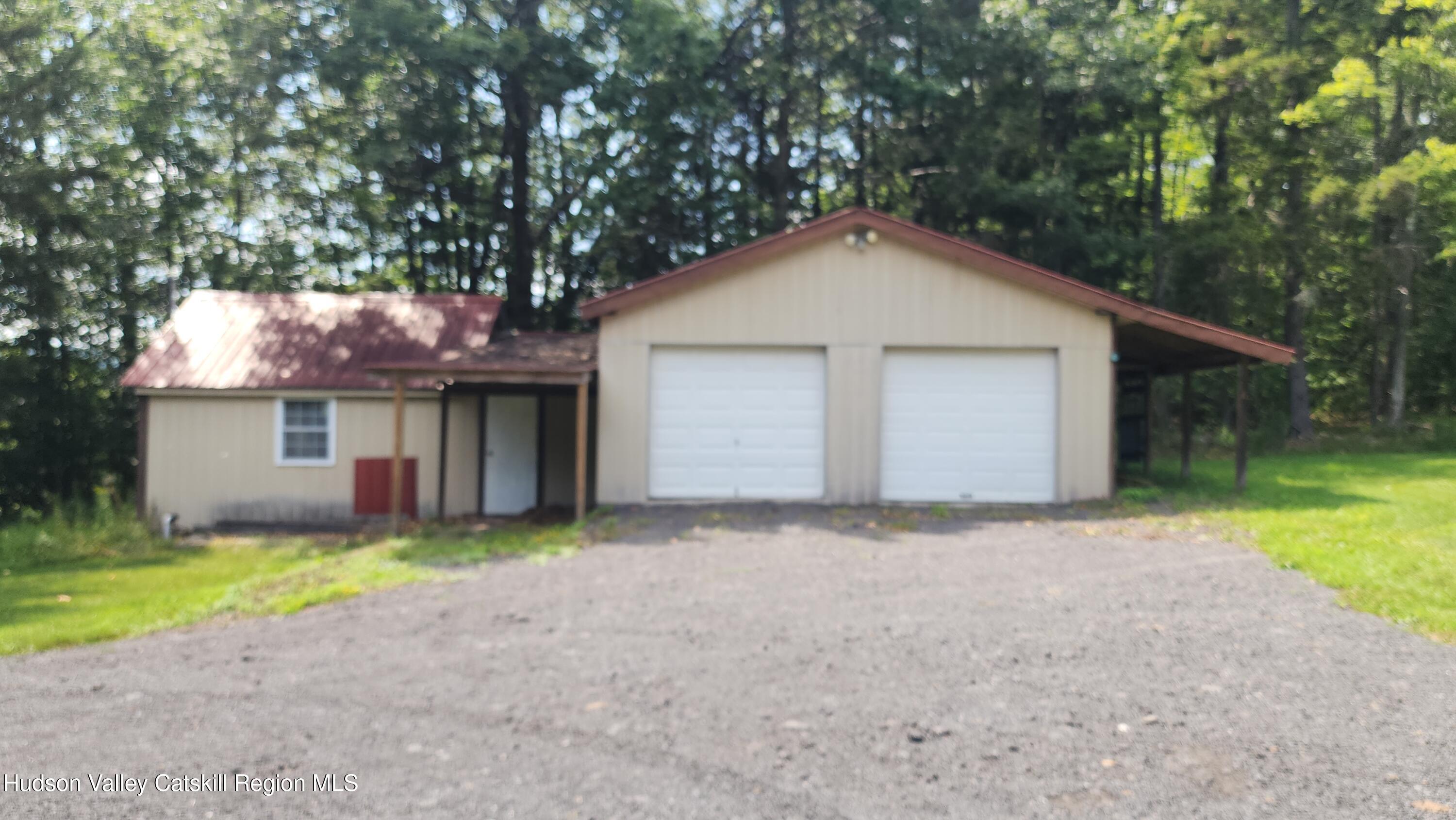 783 Broome Center Road Preston Hollow, NY 12469 - Photo 4 of 34 a view of a house with a yard and garage