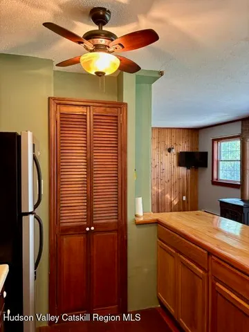 a view of room with window and cabinet