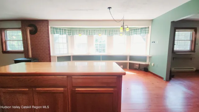a view of kitchen with furniture and large window