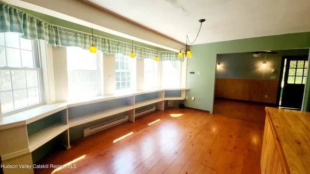 a room with window and a table