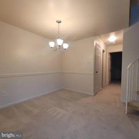 an empty room with a chandelier