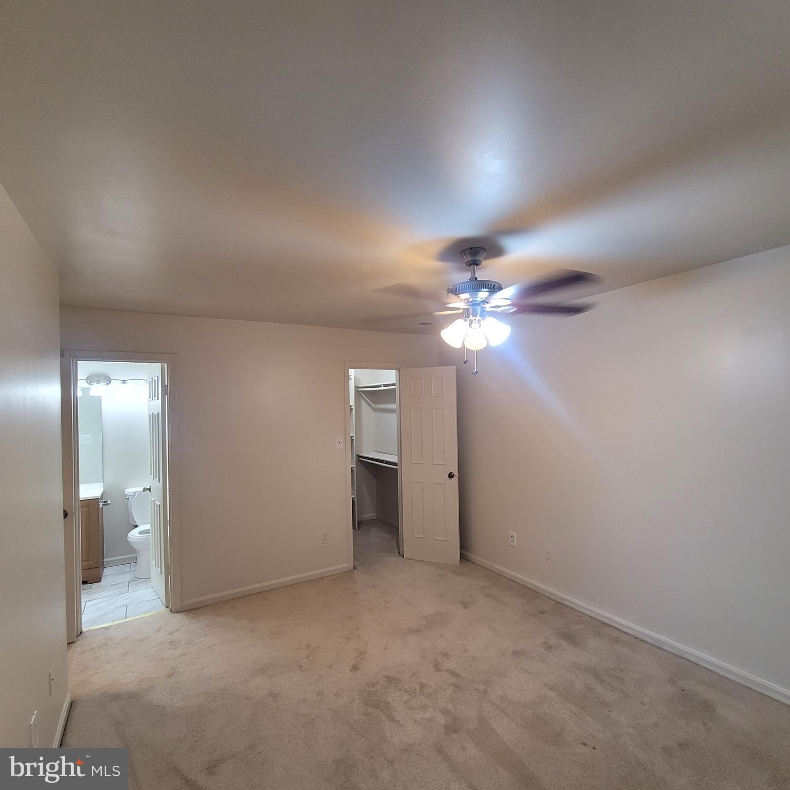 6903 B Sandra Marie Circle, Unit 6903B Alexandria, VA 22310 - Photo 12 of 21 a view of a chandelier fan and closet