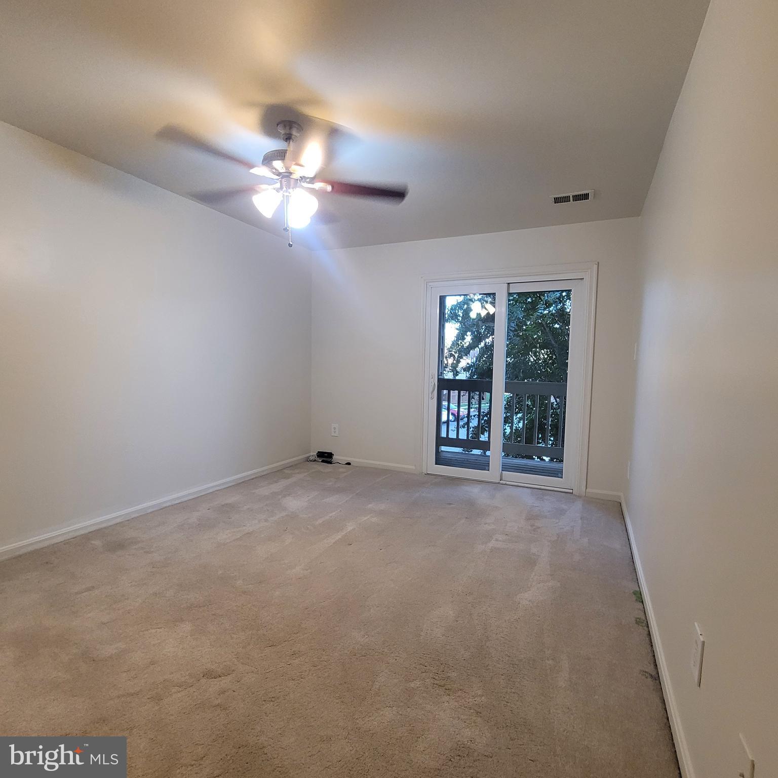 6903 B Sandra Marie Circle, Unit 6903B Alexandria, VA 22310 - Photo 13 of 21 a view of an empty room with chandelier fan
