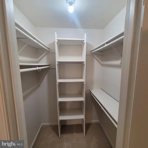 a view of an empty walk in closet