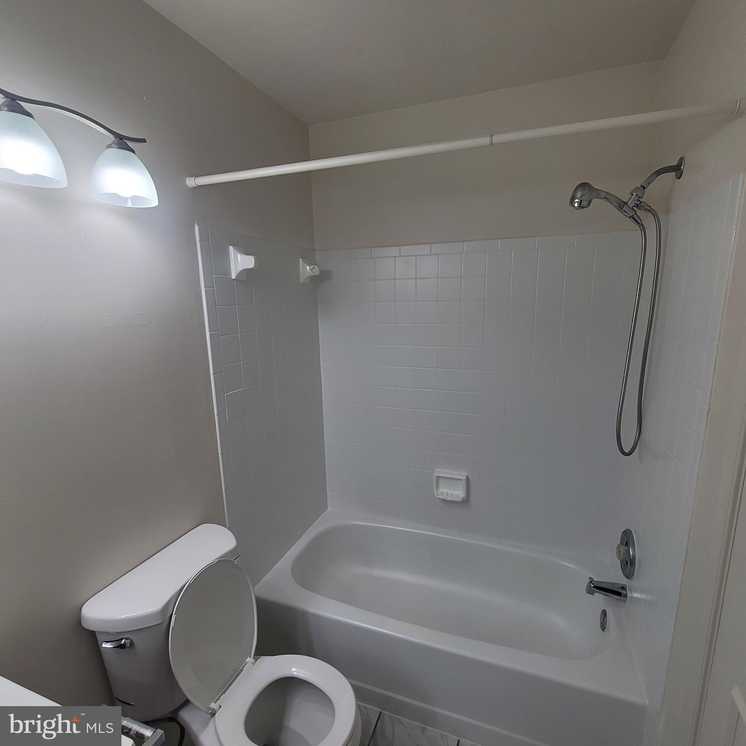 6903 B Sandra Marie Circle, Unit 6903B Alexandria, VA 22310 - Photo 15 of 21 a bathroom with a toilet and a shower