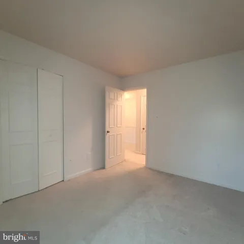 a view of an empty room and a window