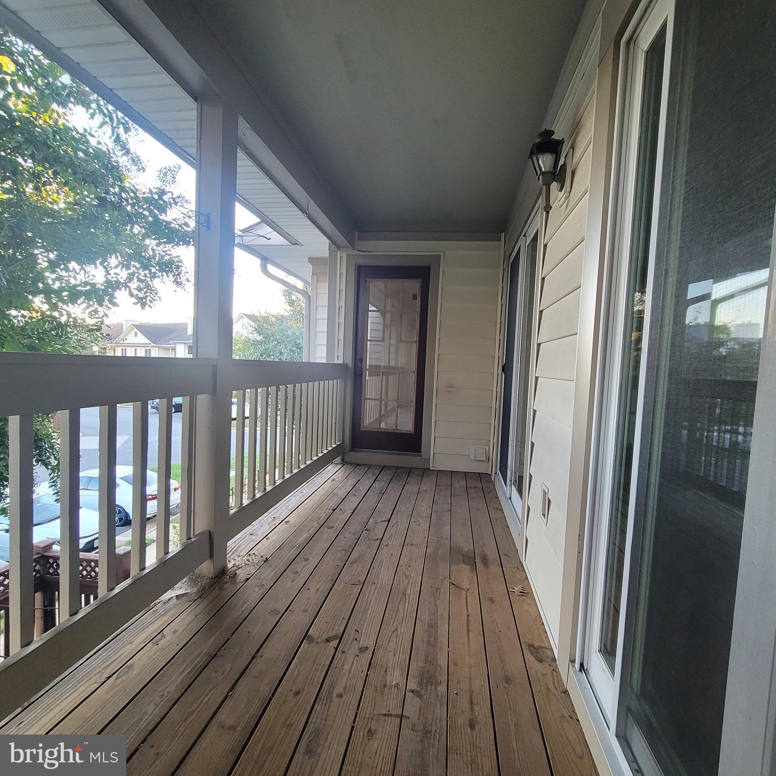 6903 B Sandra Marie Circle, Unit 6903B Alexandria, VA 22310 - Photo 20 of 21 a view of a balcony with wooden floor