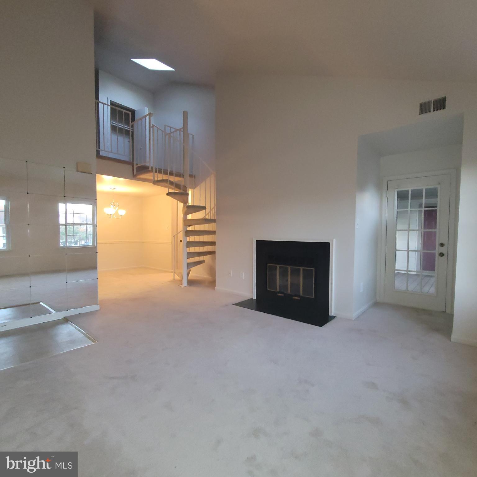 6903 B Sandra Marie Circle, Unit 6903B Alexandria, VA 22310 - Photo 4 of 21 a view of an empty room with a kitchen