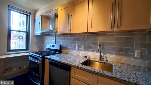 a kitchen with a stove and a refrigerator