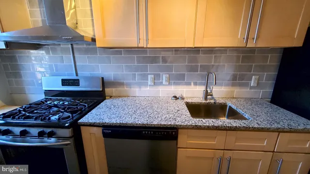 a view of wooden floor and windows in a room