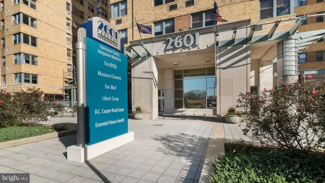 a view of a building with an outdoor space and trees