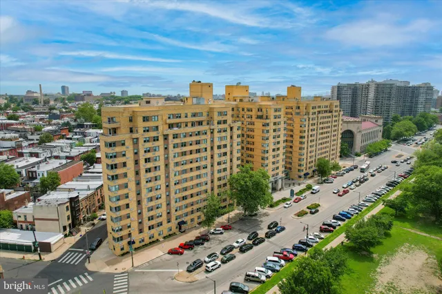 a city street lined with buildings and trees