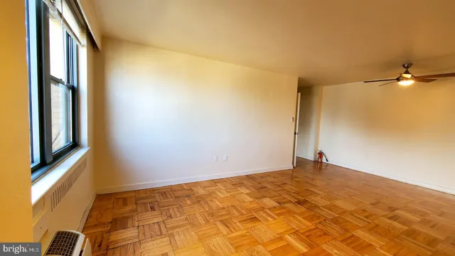 a view of an empty room with a window